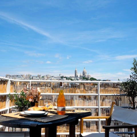 Pour yourself a glass of French wine and drink in views of the Sacré-Coeur