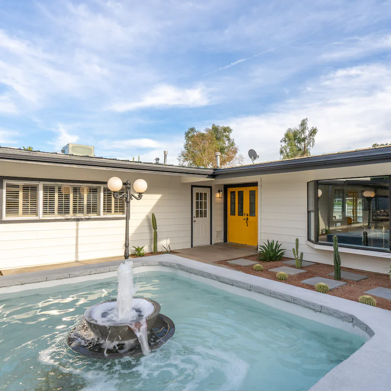 Admire the water feature outside your front door