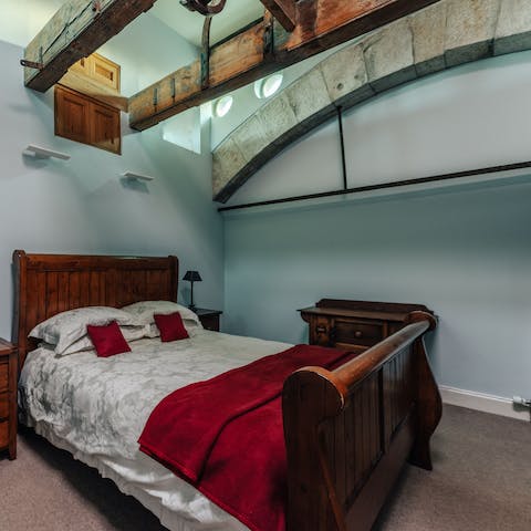Slumber peacefully in this incredible antique bed, beneath striking architecture