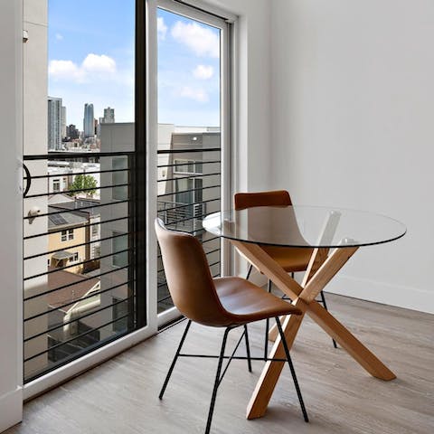 Sit down to a meal at the window-side table while feasting on Denver skyline views