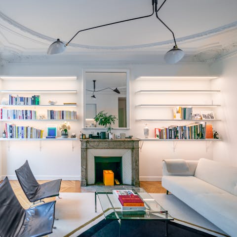 Unwind with a glass of wine and a book in the bright living area