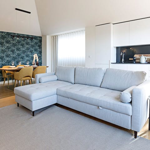 Kick back and relax on the L-shaped sofa in the light-filled living room