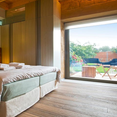 Step right out to the lush garden from the vast main bedroom