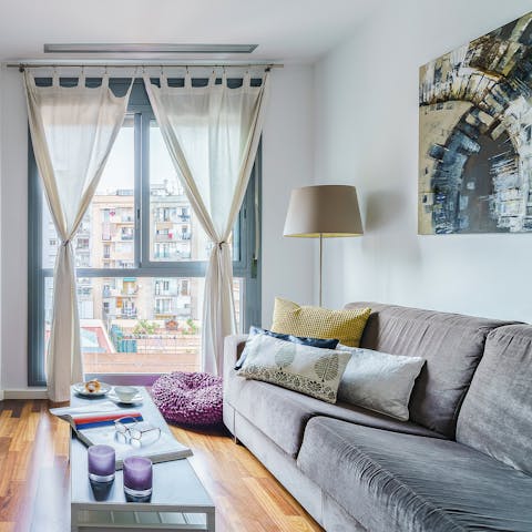 Kick back in the bright living room with a glass of Spanish wine, feasting on Eixample views