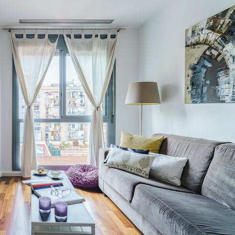Kick back in the bright living room with a glass of Spanish wine, feasting on Eixample views