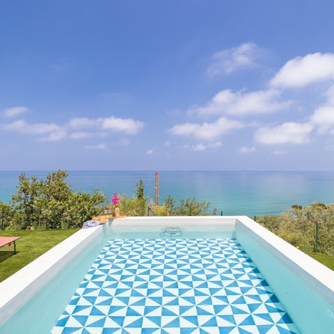 Swim in the private pool as the Sicilian sun warms your skin