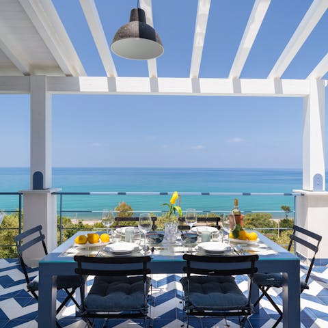 Soak up the sea views as you dine on the private balcony