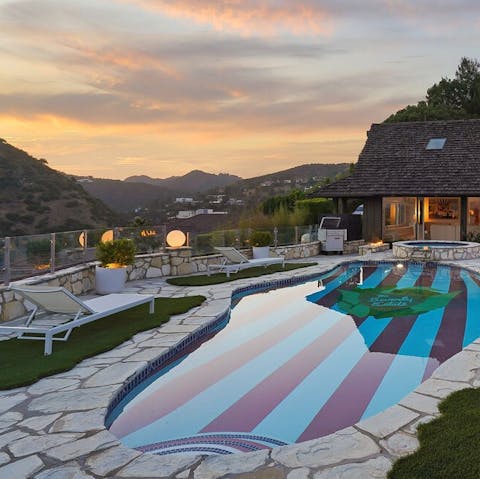 Enjoy a dip in the pool with mountains in the background