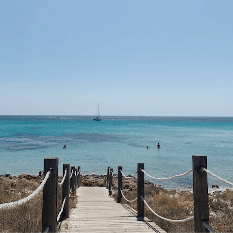 Drive less than five minutes to Cala Salada beach