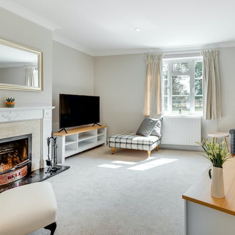 Relax and unwind in front of the fire in the cosy living room