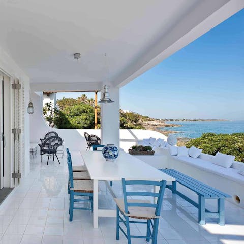 Sit down to an elegant al fresco meal while taking in coastal views
