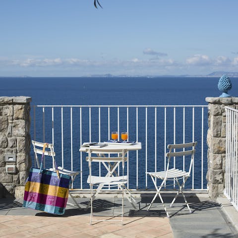 Gaze out at the sea while enjoying the sunshine from the shared patio