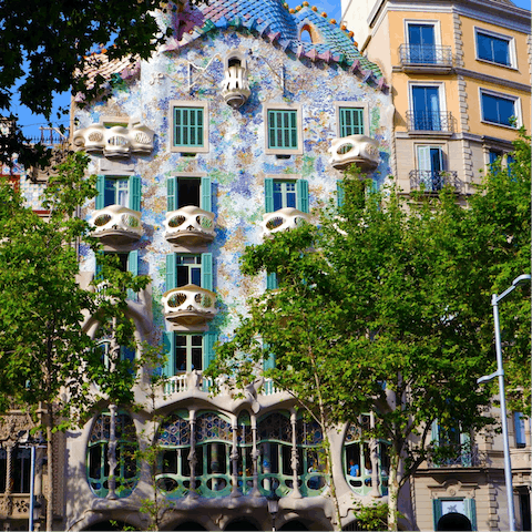 Visit Antoni Gaudí’s Casa Batlló, a two-minute stroll away