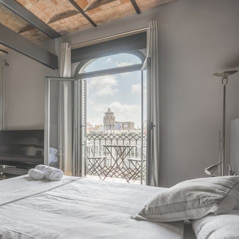 Take in the city vistas from your bed