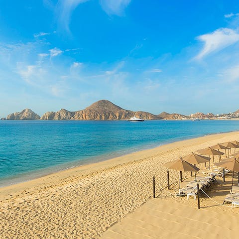 Stroll along the beachfront and watch the tide roll in beneath the baking sun