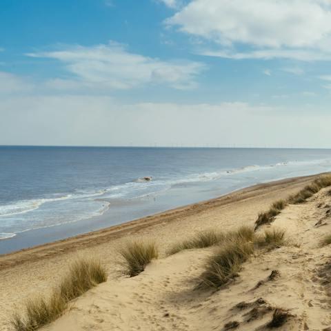 Drive eighteen minutes to see the beautiful coast at Corton beach