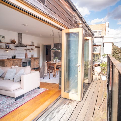 Fling open the bi-fold doors and invite the sunshine into your wonderfully open living spaced