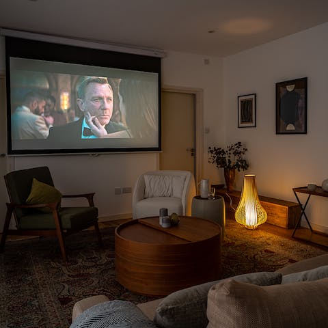 Curl up in front of the projector for a cosy movie night in