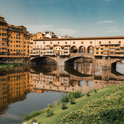 Stay thirty steps from the famous Ponte Vecchio bridge over the River Arno
