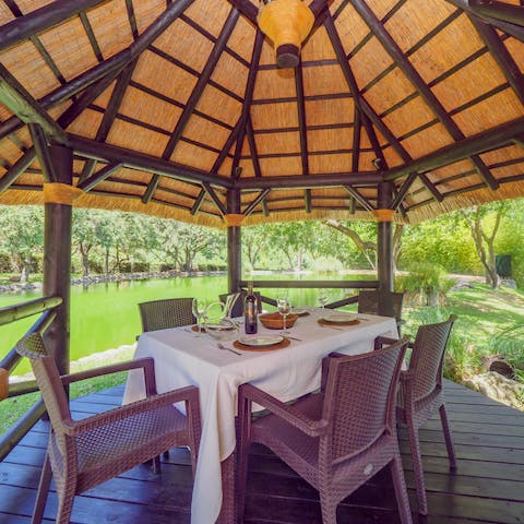 Feast on waterside barbecue meals prepared on the grill at the outdoor dining area