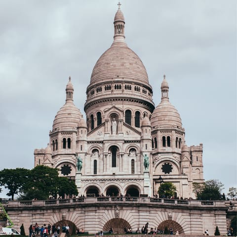 Gaze up at the beautiful Sacré-Cœur Basilica, a ten-minute walk away