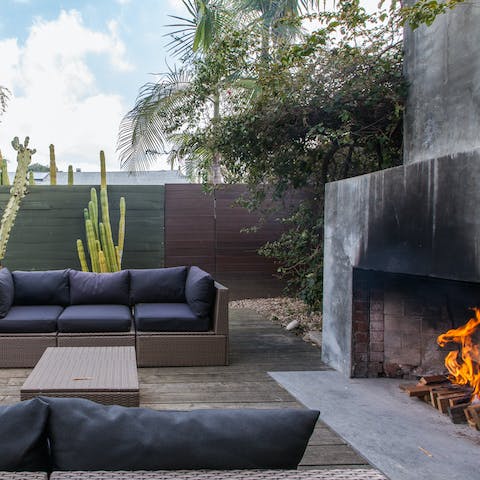 Spend long balmy evenings around the outdoor fireplace and cacti