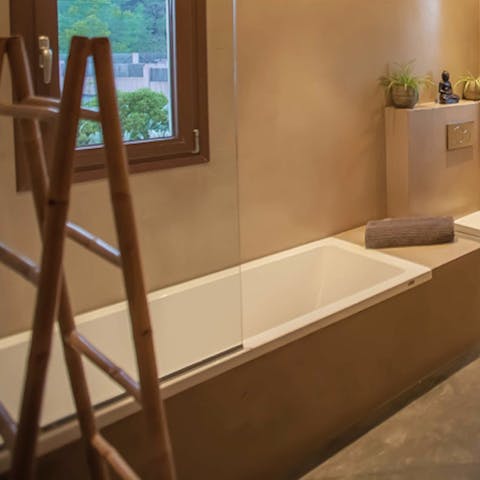 Soak in one of the home's deep bathtubs