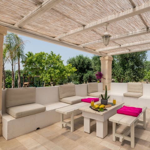 Open a bottle of wine and relax on the covered patio 