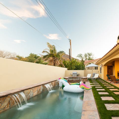 Take a dip in the private pool and hot tub