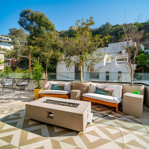 Light the fire pit and savour sunset drinks on the terrace