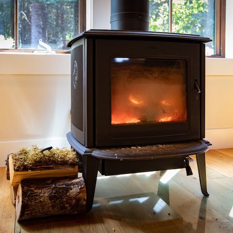 Cosy up next to the log-burning stove after a day spent in nature 