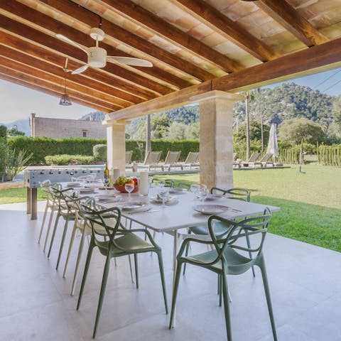 Dine on the covered terrace as greenery wraps around you