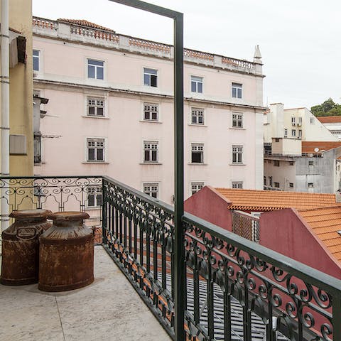 Gaze over terracotta rooftops from your private balcony