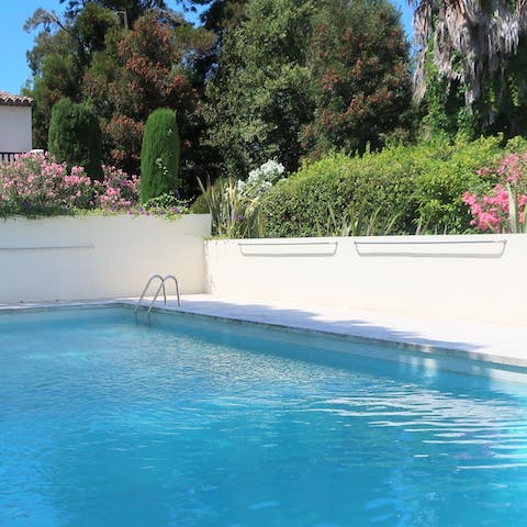 Swim a few lengths in the communal pool, surrounded by lush greenery