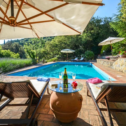 Enjoy a glass of cool fizz by the pool while taking in the afternoon sunshine