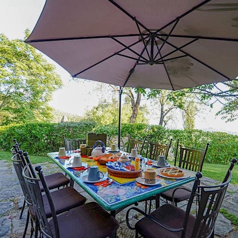 Dine alfresco with views stretching across the rolling countryside of Umbria