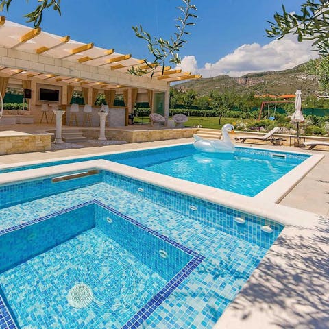 Relax in the heated pool and adjoining jacuzzi