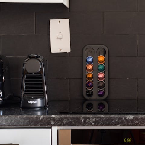 Sip coffee from the Nespresso machine