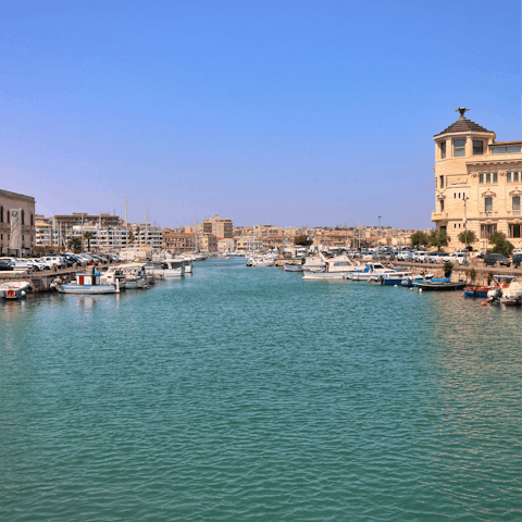 Arrange a boat trip around the island to explore Ortigia from the sea