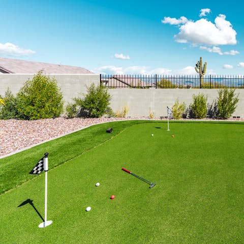 Practice your putt on the six-hole putting green