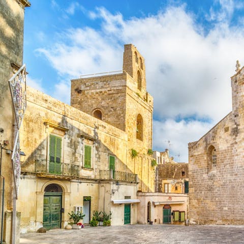 Explore Otranto and its 11th-century cathedral, a fifteen-minute drive away