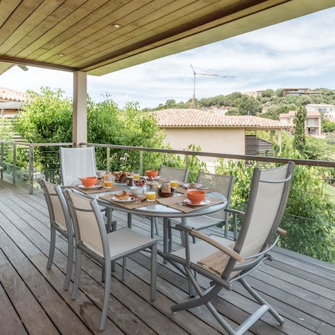 Tuck into a Corsican banquet on the decked balcony