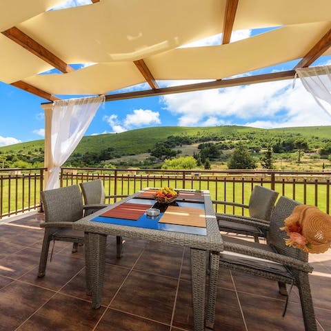Serve up some locally sourced fresh fish under the pergola