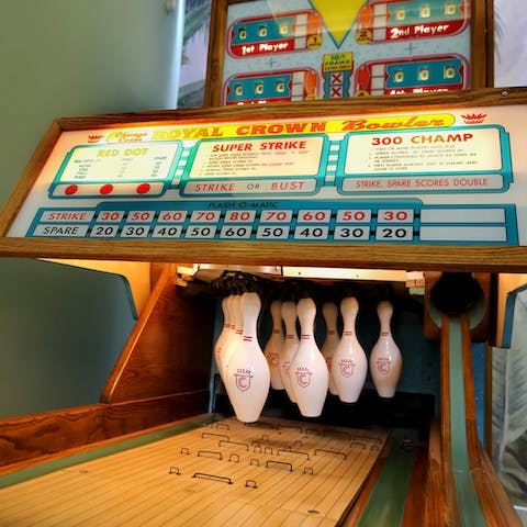 Strike it lucky on the vintage ten-pin bowling lane in the games room