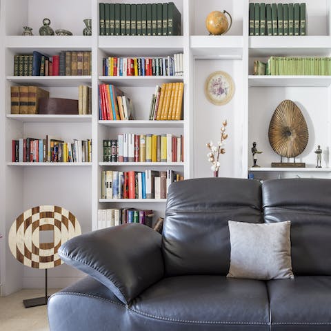Choose a book and relax on the leather sofa