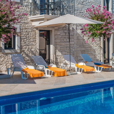 Spend hours relaxing by the private pool