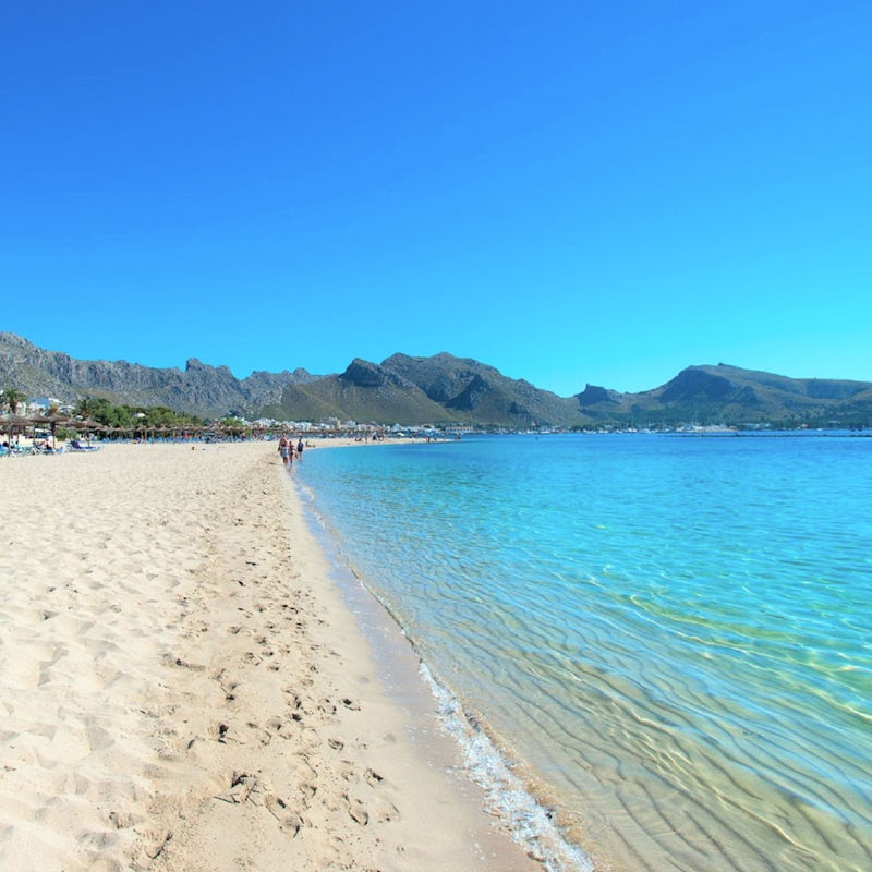 Bask in the warm sunshine on Can Cap de Bou Beach, a short drive away