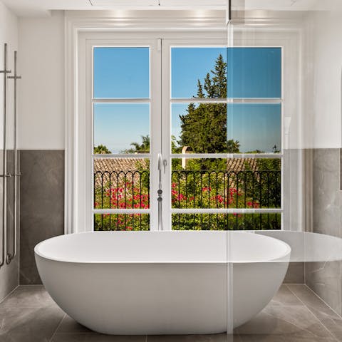 Unwind after a long day with a soak in the freestanding tub – a glass of wine, optional