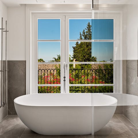 Unwind after a long day with a soak in the freestanding tub – a glass of wine, optional