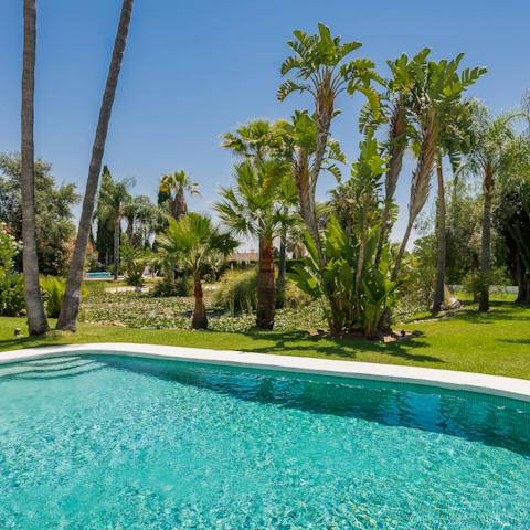 While away your holiday poolside, stretching out on the lounge chairs when you need to dry off